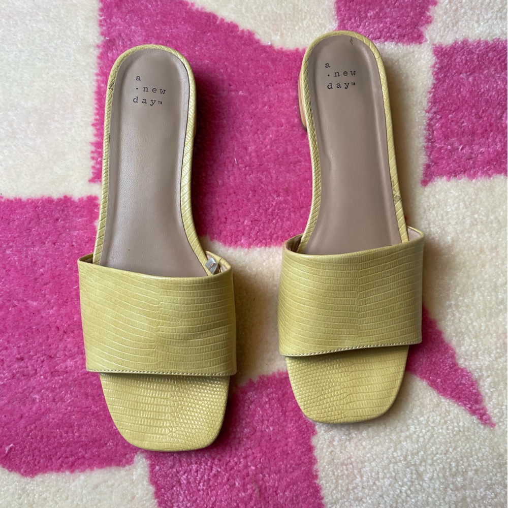 A New Day pastel yellow snakeskin block heel slides